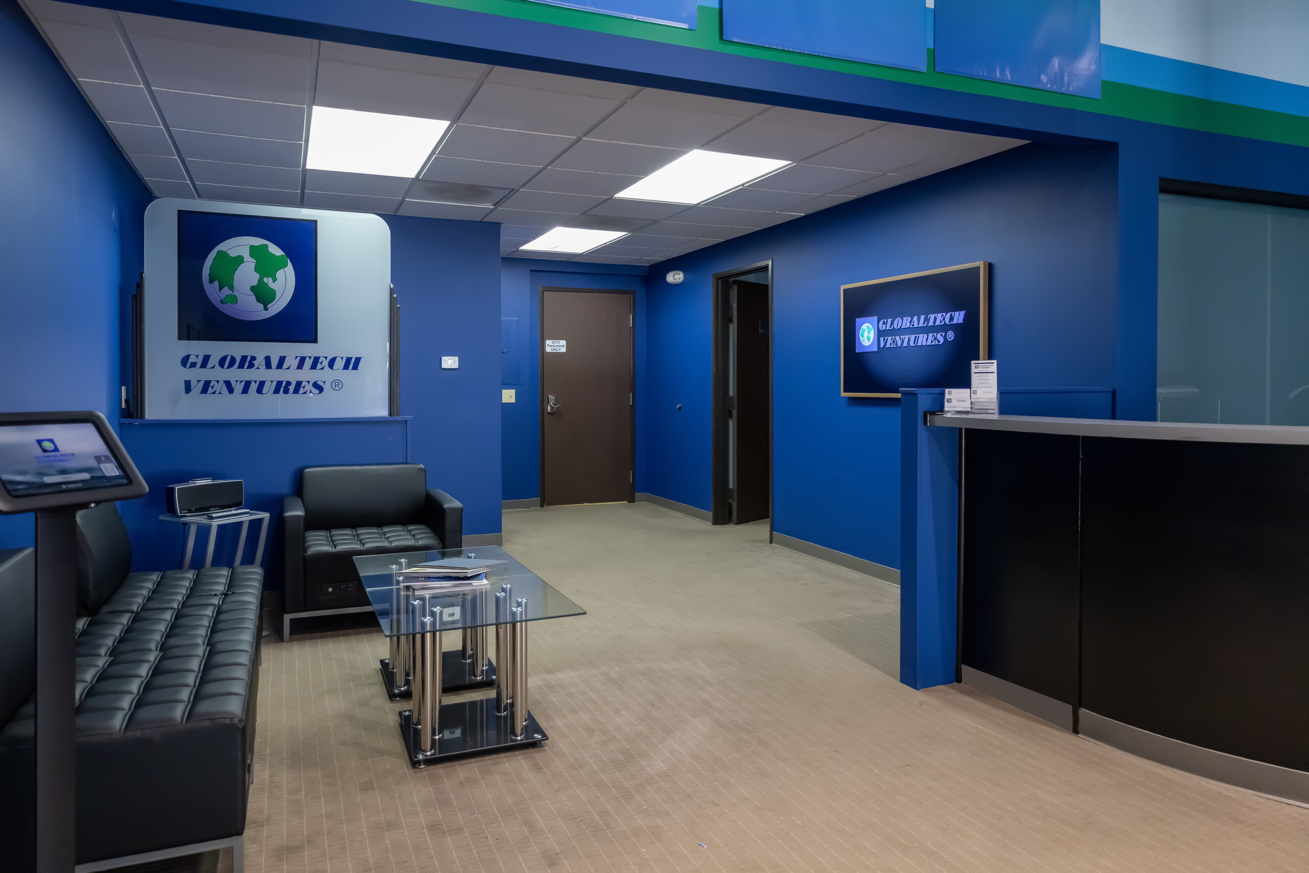 Reception area at Global Technology Ventures Inc. (GTV) with company signage and logo